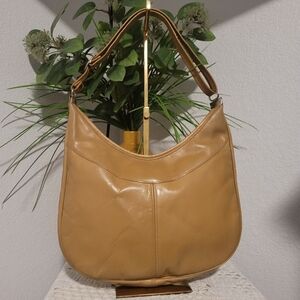 Vintage Tan Leather Hobo Boho Shoulder Bag with Zipper Closure , featuring a Uni